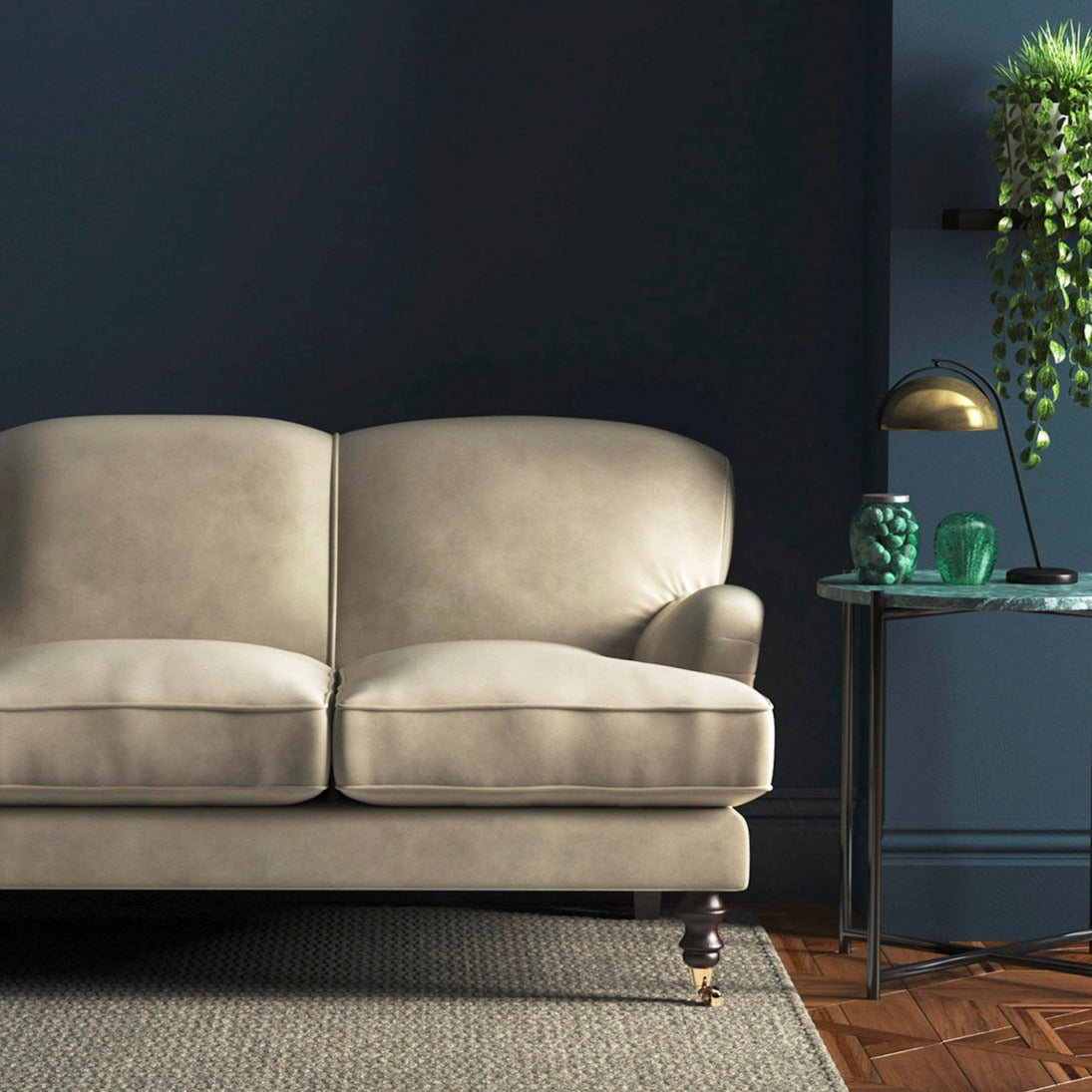 Sofa covered in a cream velvet upholstery fabric