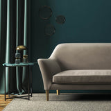 Sofa covered in a grey velvet upholstery fabric