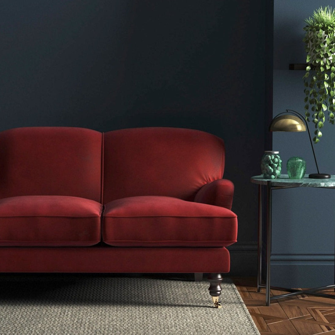 Sofa covered in a red velvet upholstery fabric